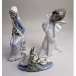 Three Lladro porcelain figures of a winged cherub, a swan with ducks, and a lady seated with