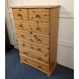 A pine chest of two short over five long drawers with knob handles on bracket base, 81cm