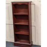 A narrow open bookcase with three shelves on plinth base, 48cm
