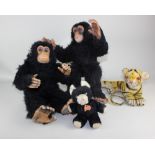 Two Dean's Childsplay toy chimps, one with yellow label, together with a plush toy musical cat