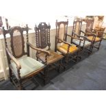 Two pairs of similar cane backed oak carver dining chairs, and a single dining chair with carved