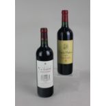 A bottle of Frank Phelan 2009 Saint-Estephe red wine 750ml 13.5% vol together with a bottle of La