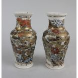 A pair of Japanese Satsuma ware baluster vases, with figural decoration and gilt embellishments,