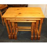 A nest of three pine rectangular side tables on block and turned supports, largest 63cm