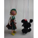 Two Pelham puppets; a black poodle and a Tyrolean girl, both boxed