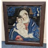A framed Victorian woolwork picture of the Madonna and child with text 'Our Saviour and the Virgin