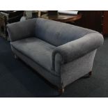 A blue grey upholstered Chesterfield sofa on turned feet and castors 190cm