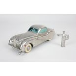 A Prameta Kolner Automodelle Jaguar XK 120 metal clockwork model car, in chrome, with key