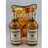 Two one litre bottles of Teacher's Highland Cream Perfection of Old Scotch Whisky, in a twin pack