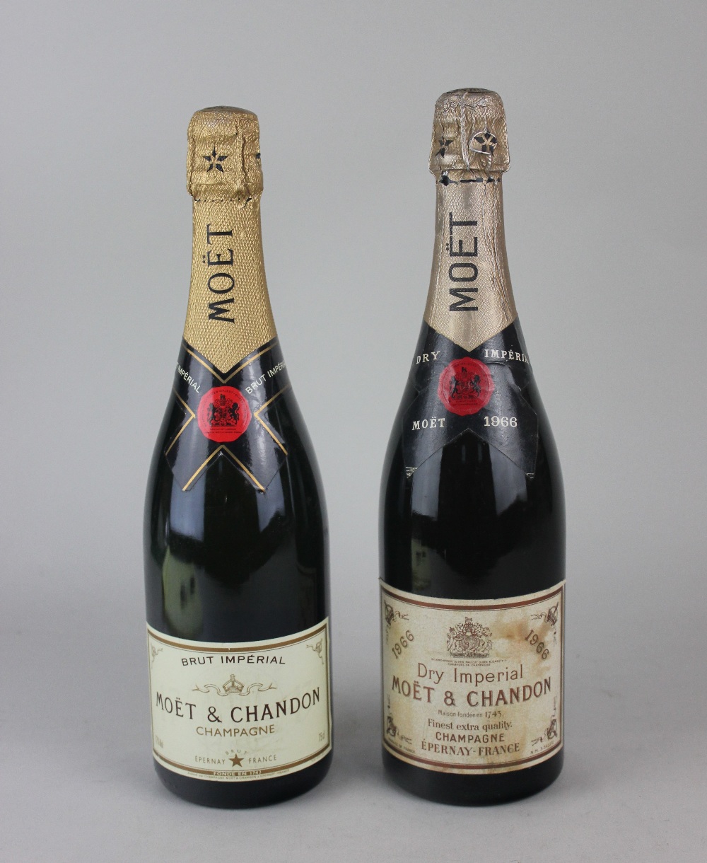 A bottle of Moet & Chandon 1966 Dry Imperial champagne and a bottle of Moet & Chandon Brut