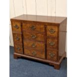 An American Baker Furniture reproduction bachelor chest with rectangular fold over top above an