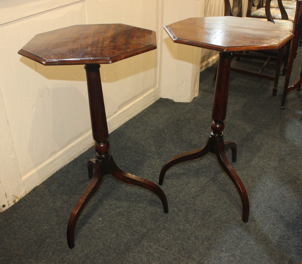 A pair of 19th mahogany octagonal wine tables on turned supports and tripod bases 42cm