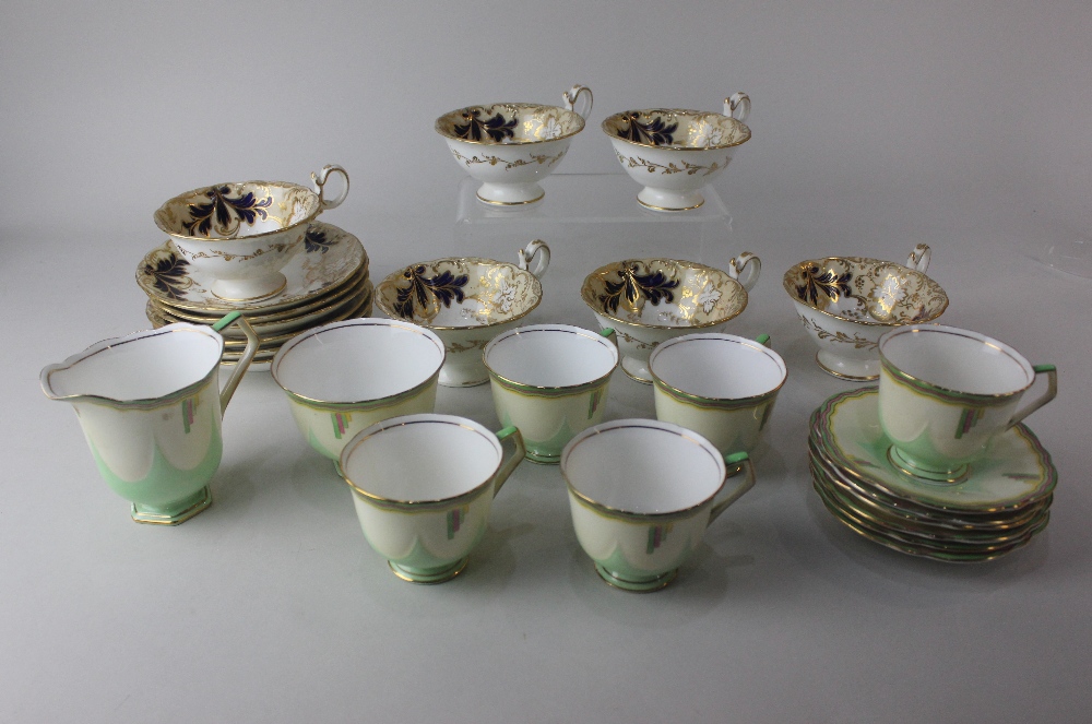A set of six Victorian adelaide shape teacups and saucers gilt and blue foliate decoration and an