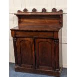 A Regency rosewood chiffonier with raised shelf back and shell carved frieze above single drawer and
