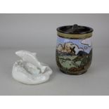 A Royal Doulton tobacco jar, possibly by Ethel Beard, decorated with a scenic landscape, 14.5cm