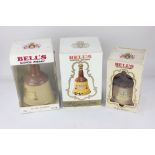 Two Bell's blended scotch whisky in Wade ceramic bell decanters, both 75cl and another smaller