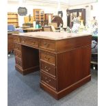 A Victorian style mahogany pedestal desk, with rectangular brown leather inset top above an