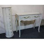 A white column of eight small drawers 101cm together with a rectangular two drawer side table on
