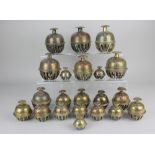 A collection of twenty-one various Middle Eastern brass elephant claw bells, floral and foliate