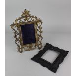 A Rococo style gilt cast metal photograph frame, to hold a photograph 14.4cm by 9.7cm, together with