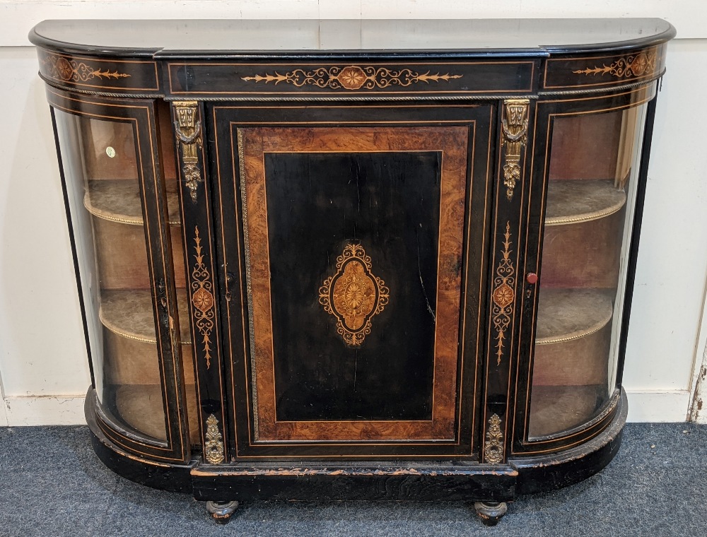 A Victorian gilt metal mounted ebonised credenza central breakfront cupboard with burrwood banding