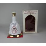 A Bells Scotch Whisky Wade porcelain decanter to commemorate the birth of Prince Henry of Wales 15th