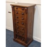 A Wellington chest of seven drawers with knob handles and locking bar (no key) on plinth base, 48cm