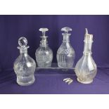 A glass four section decanter, together with three various cut glass decanters, one metal mounted (