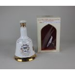 A Bells Scotch Whisky Wade porcelain decanter to commemorate the birth of Prince William of Wales