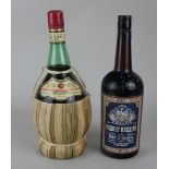 A bottle of Peter F Heering Cherry Heering cherry brandy and a bottle of Crema Marsala all'Uovo