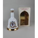 A Bells Scotch Whisky Wade porcelain decanter to commemorate the 60th birthday of Her Majesty