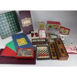 A collection of various games, games boards and puzzles, to include Dominoes, Hustle, Reversi Chad
