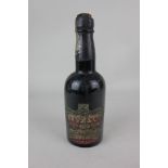 An early 20th century Bass & Co. Royal Ale bottle of beer with oval paper Bass label and crown