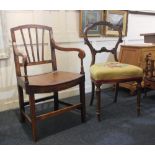 A Victorian carved balloon back dining chair with tapestry seat and an oak elbow chair with solid
