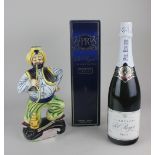 A bottle of Pol Roger White Foil Brut champagne, together with a bottle of Drioli apricot liqueur in