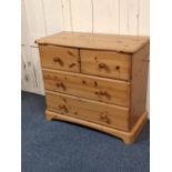 A pine chest of two short drawers over two long drawers with knob handle on bracket base, 80cm