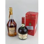 A bottle of Courvoisier cognac, boxed, together with a bottle of Bisquit Classique cognac