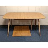 A Ercol light elm extending dining table with extra hinged double leaf on sloping legs (a/f) 154cm