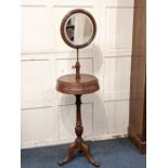 A Victorian mahogany gentleman's shaving stand with adjustable circular mirror and box top with
