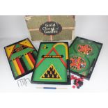 An early 20th century Lindstrom 'Gold Chest of 6 Games' boxed set containing three steel double-