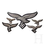 A Collection of Luftwaffe EaglesFive in total, one cape eagle (wing tips cut), two breast eagles and