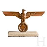 A National Desk EagleBronze metal national eagle with spread wings, left facing head, attached to