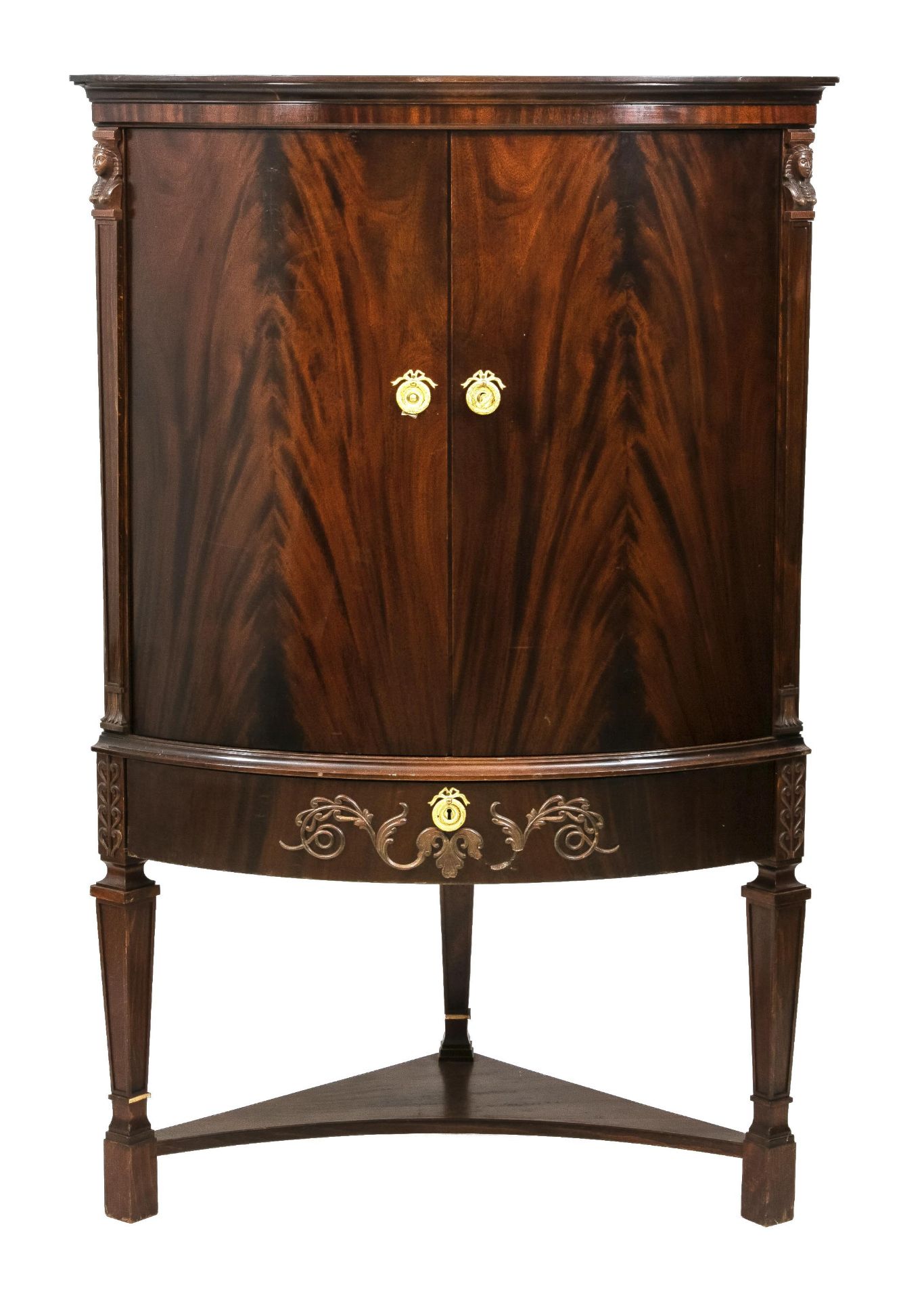 Empire style corner cabinet, 20th c., mahogany, slightly bulged doors flanked by carved caryatids,