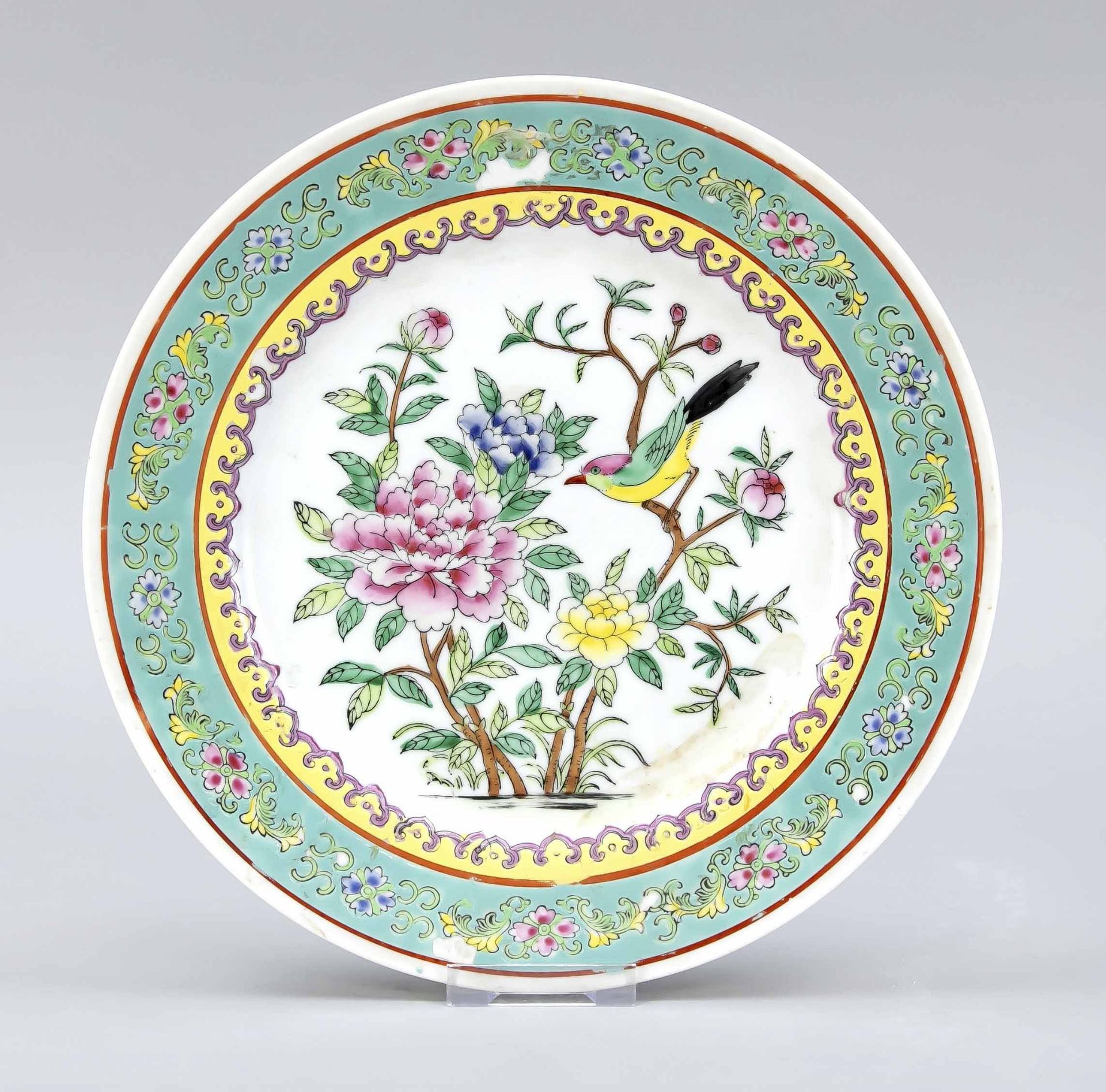 Famille rose plate, China, 20th c. In the mirror a bird in flowering branches, flag with lotus