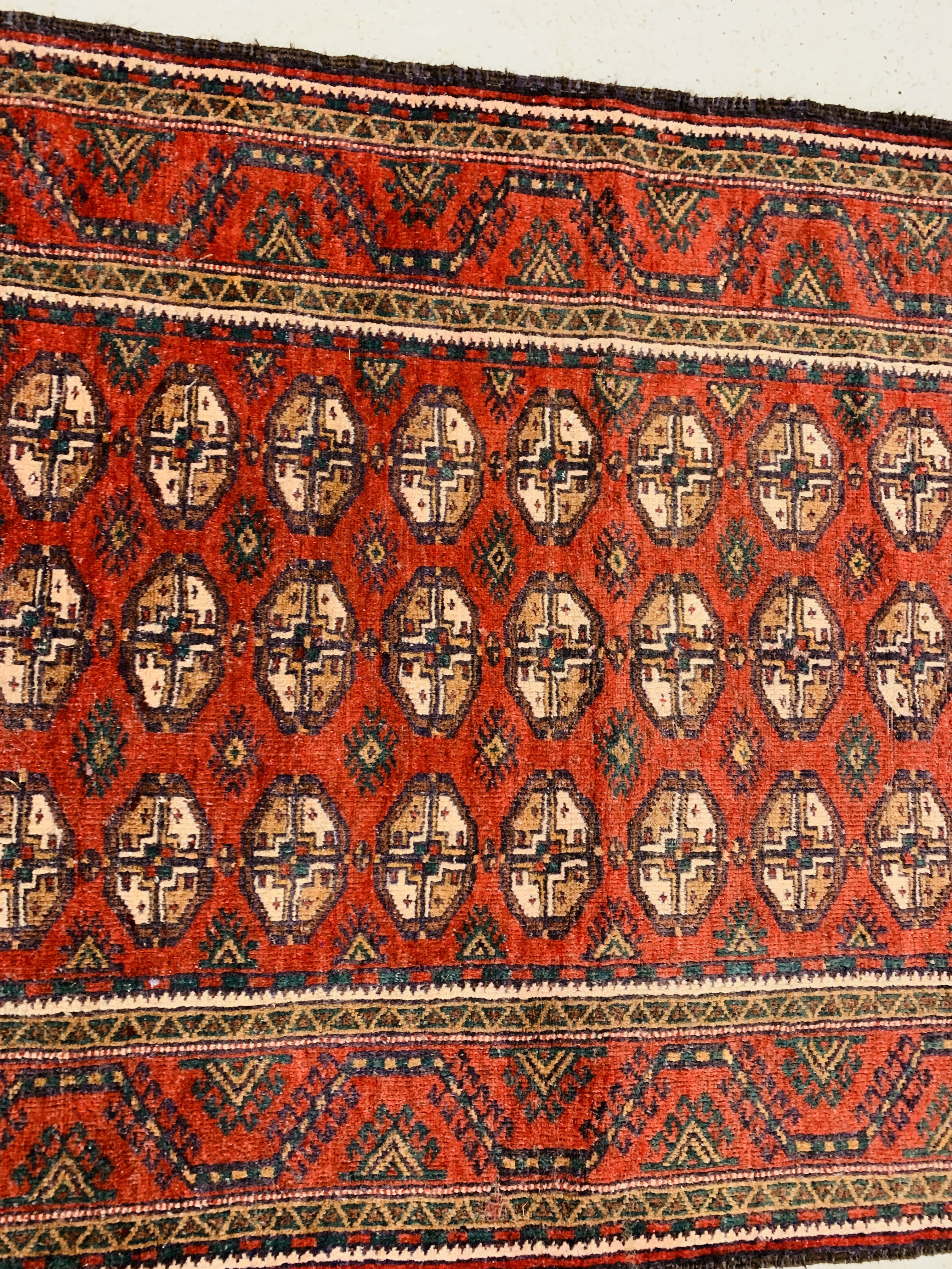 A BALUCHI RED AND BLUE PATTERNED CARPET 2.25 x 1.02. 1. - Image 3 of 4