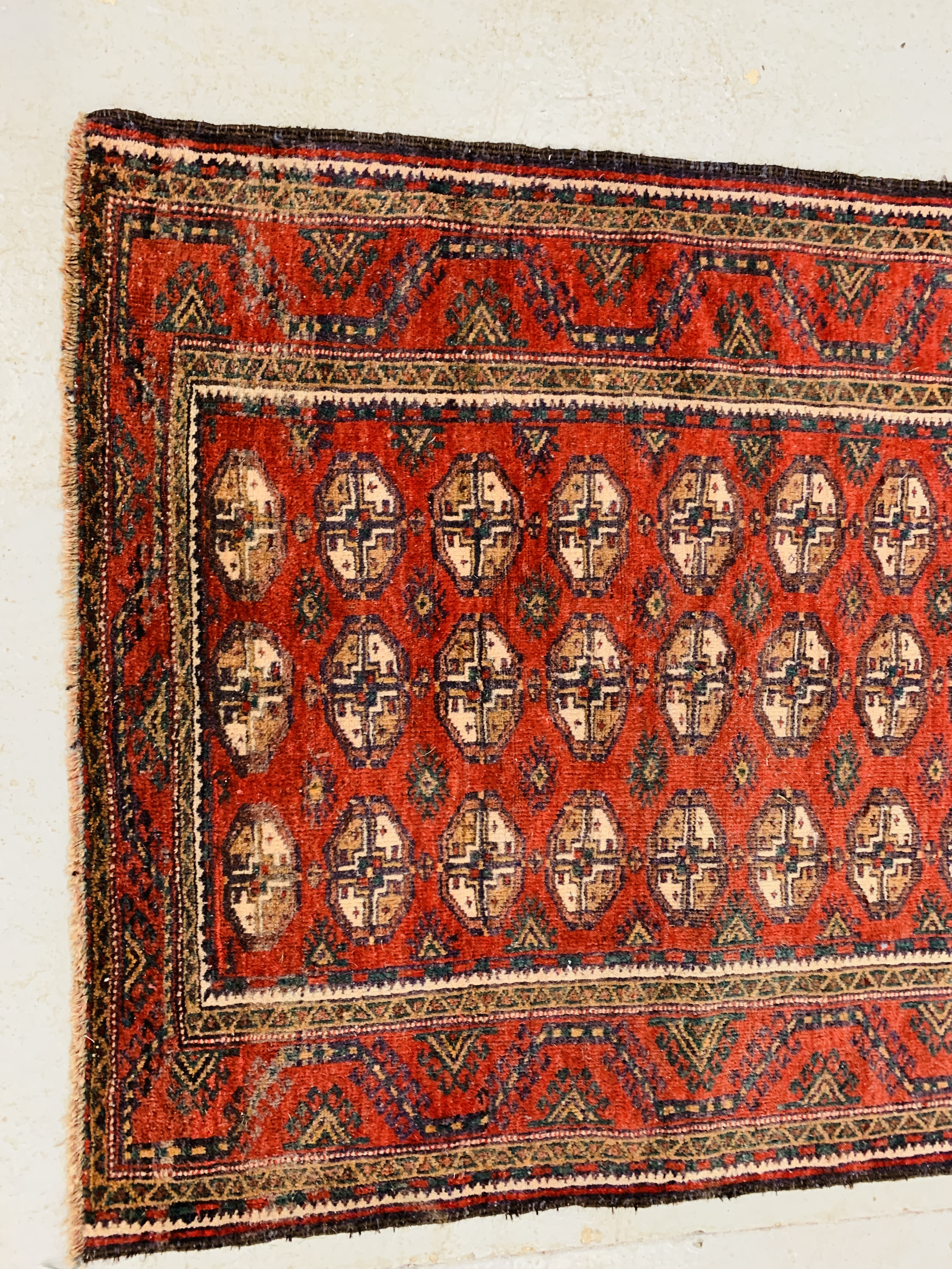 A BALUCHI RED AND BLUE PATTERNED CARPET 2.25 x 1.02. 1. - Image 2 of 4