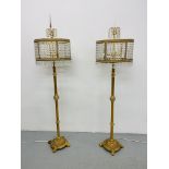 PAIR OF ORNATE GILT METAL STANDARD LAMPS WITH CRYSTAL DROP SHADES,