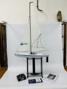 HELION AURA 650 RC SAILING YACHT ON STAND WITH TRANSMITTER & INSTRUCTIONS - SOLD AS SEEEN