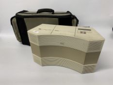 A BOSE ACOUSTIC WAVE MUSIC SYSTEM MODEL CD-3000 WITH REMOTE AND PORTABLE POWER CASE - SOLD AS SEEN