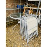 A METAL FRAMED GLASS TOP PATIO TABLE AND FOUR FOLDING CHAIRS AND A PAIR OF GILBERTO GIL FOLDING OAK